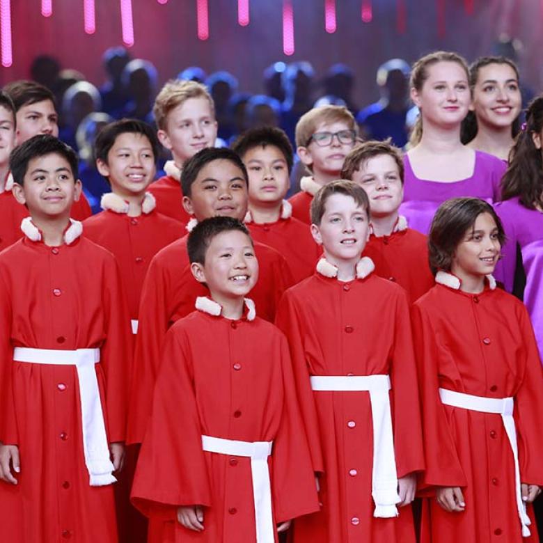 Photo of National Boys Choir and Australian Girls Choir singers on the stage 