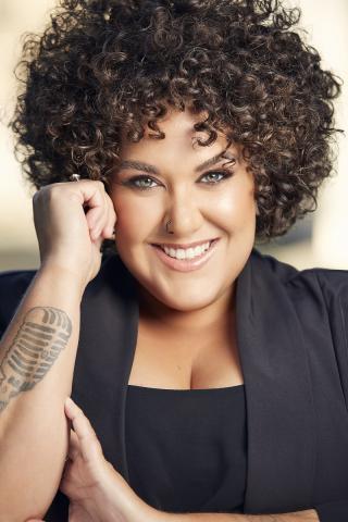 Casey Donovan smiling at camera