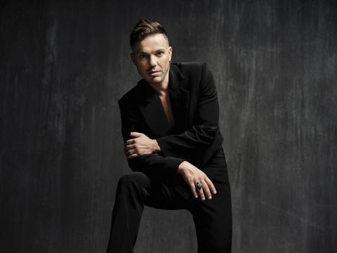 Anthony Callea wearing a black suit