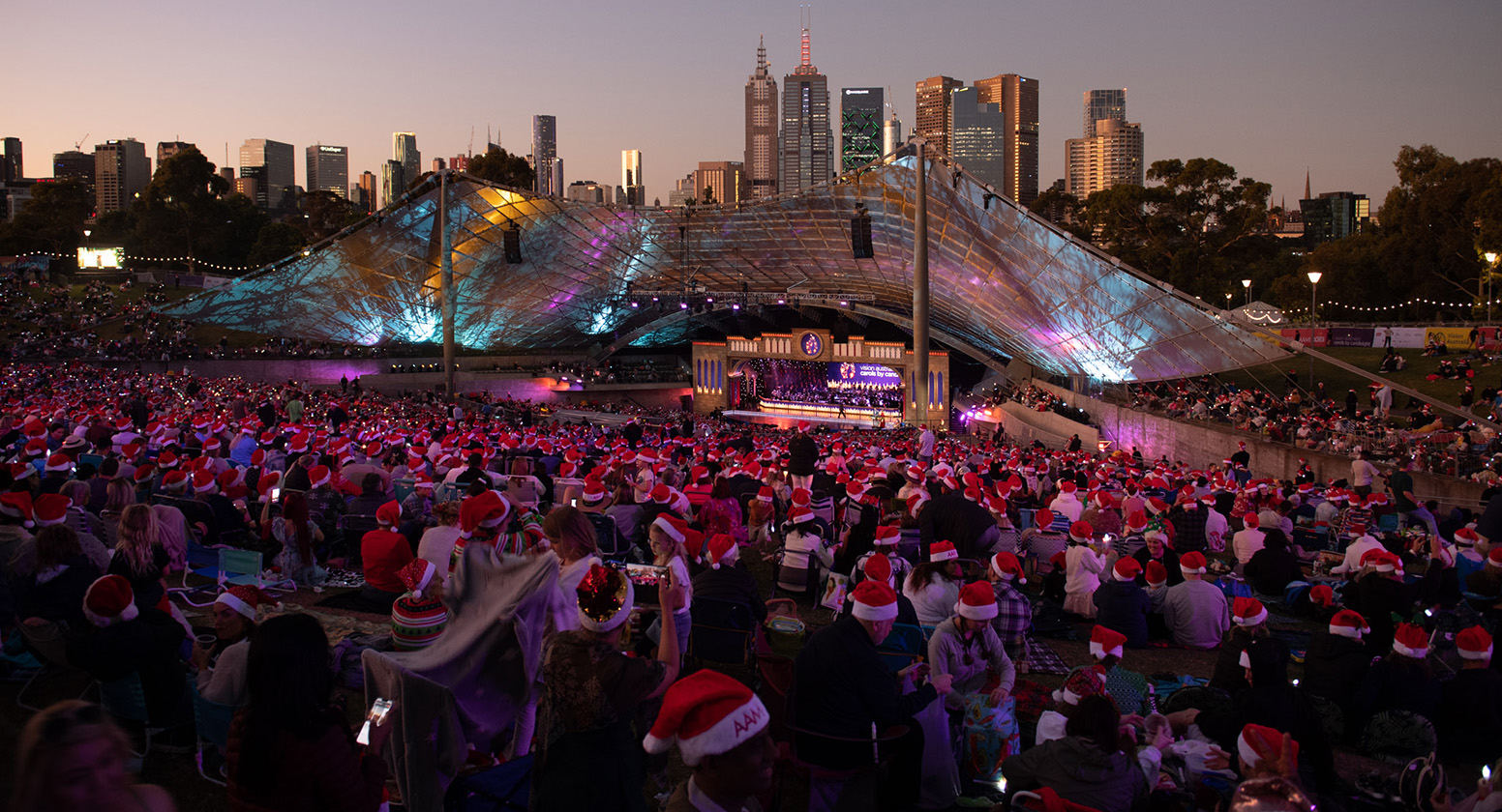 Carols audience and stage at twilight
