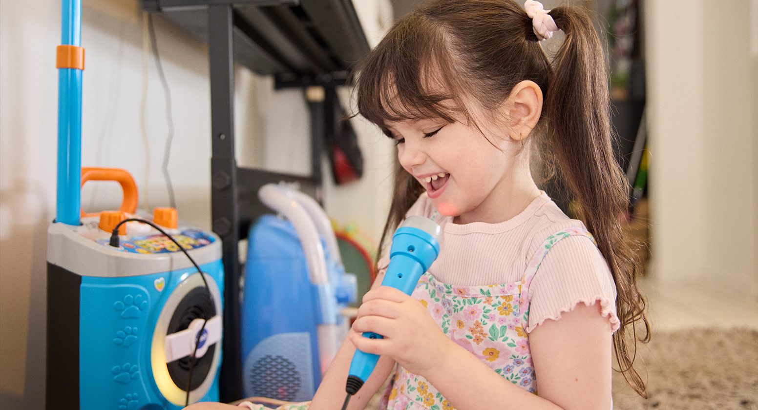 Marlee sings with a karoake machine